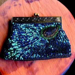 Clutch multi colored sequins .